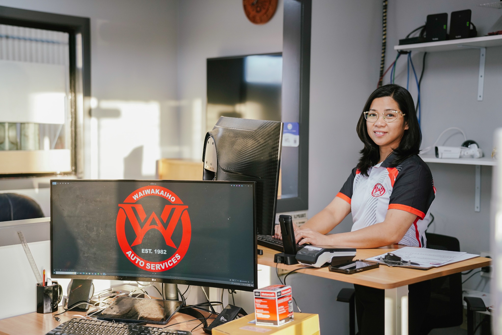 Nancy at the reception desk at Waiwakaiho Auto Services in New Plymouth