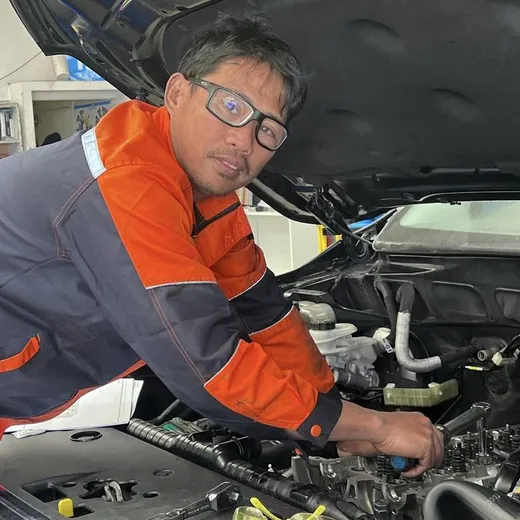 New Plymouth automotive technician working in an engine bay